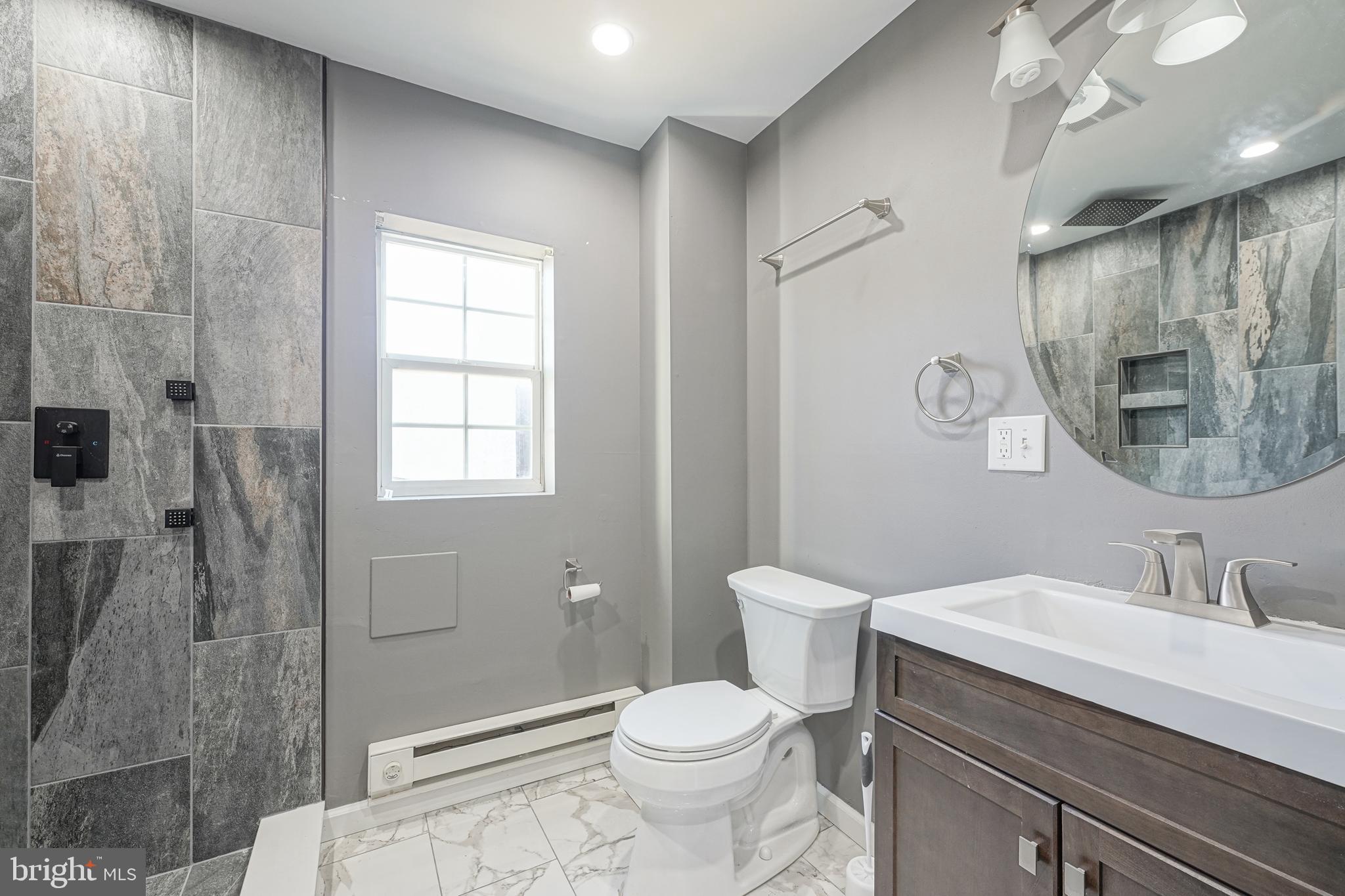 1929 North 9th Street Philadelphia, PA 19122 - Photo 7 of 49 a bathroom with a sink toilet and shower