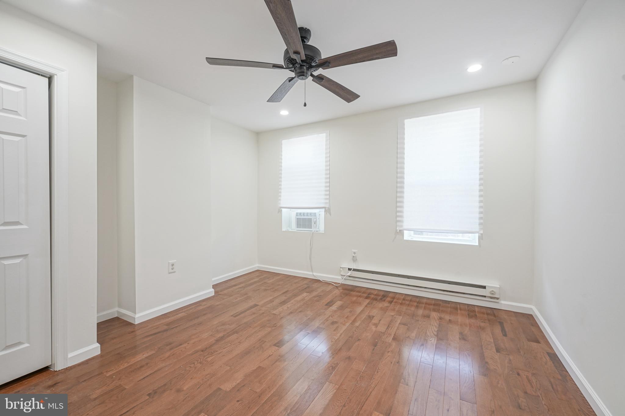 1929 North 9th Street Philadelphia, PA 19122 - Photo 8 of 49 wooden floor in an empty room with a window
