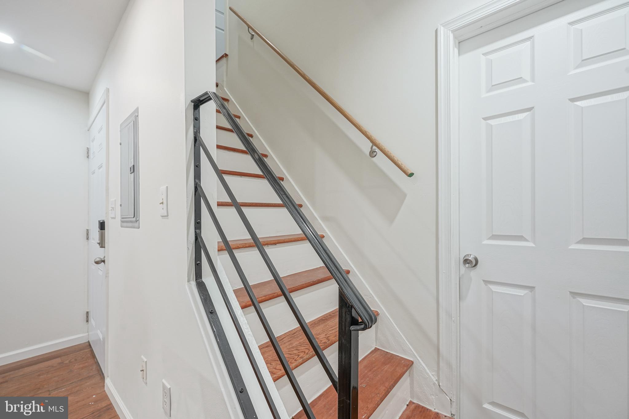 1929 North 9th Street Philadelphia, PA 19122 - Photo 10 of 49 a view of staircase with white walls and railing