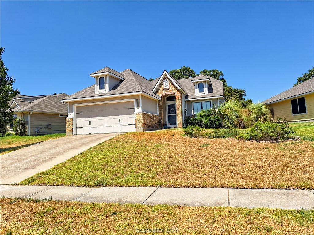 2018 Mountain Wind Loop Bryan, TX 77807 - Photo 1 of 1 a front view of a house with a yard