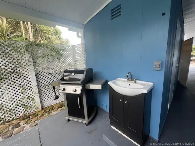 a bathroom with a sink toilet and window