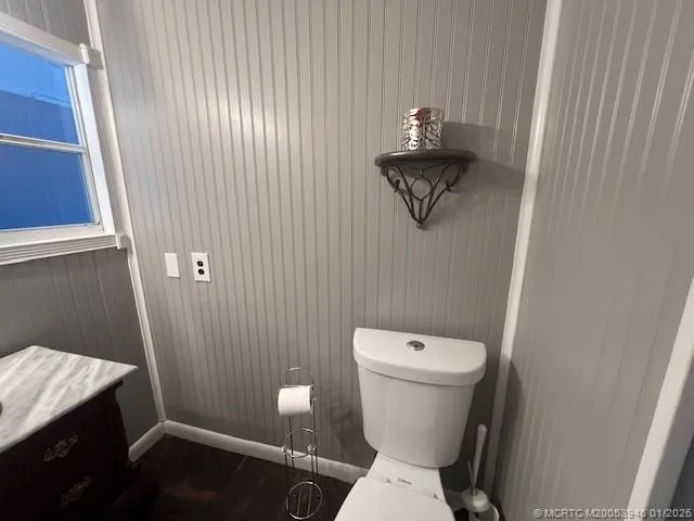 a bathroom with a toilet and a sink