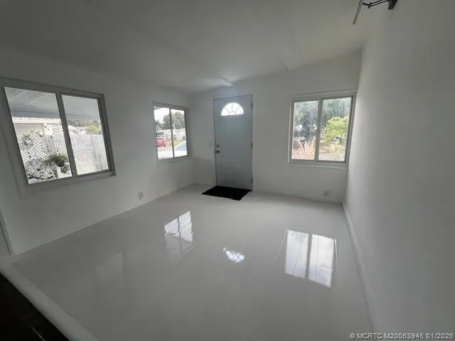 a view of an empty room with a window