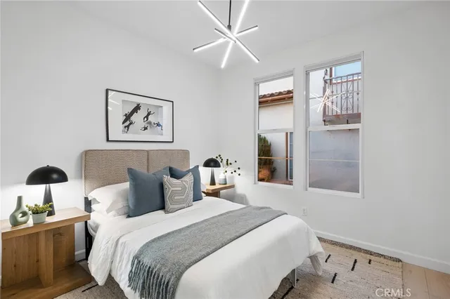 an aerial view of multiple houses with a yard