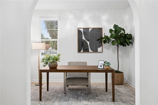 a view of a workspace with furniture