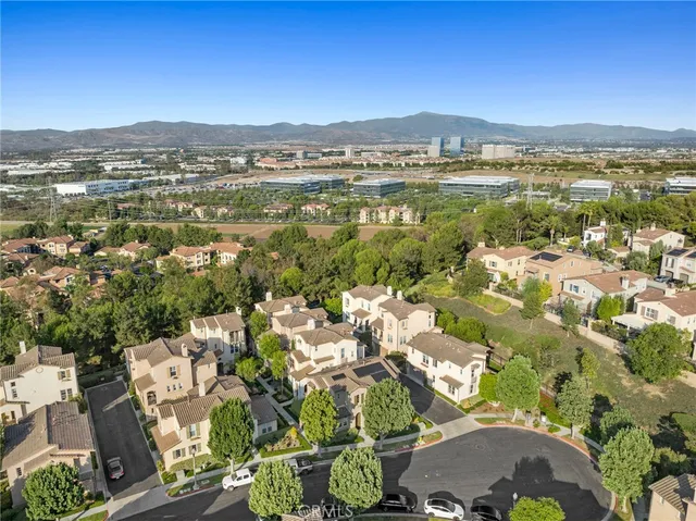 a view of multiple house with a street