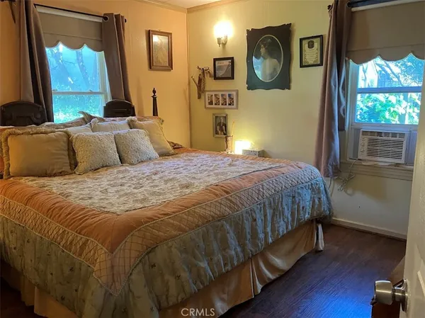 a view of a workspace with furniture and book shelf