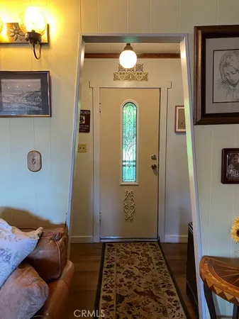 a living room with furniture and flowers