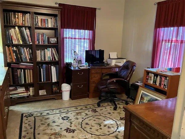 a living room with furniture and flowers