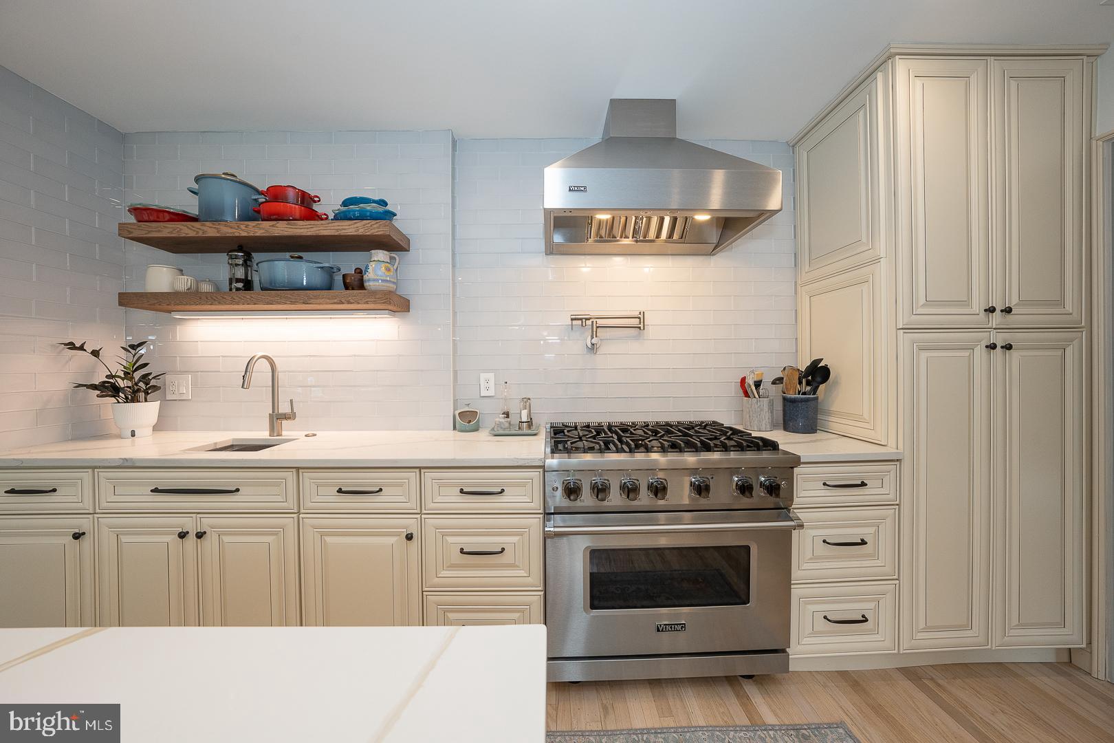 945 Lafayette Road Bryn Mawr, PA 19010 - Photo 16 of 53 a kitchen with stainless steel appliances a stove and cabinets