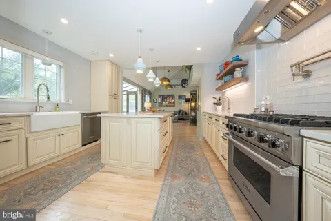 a kitchen with cabinets and window
