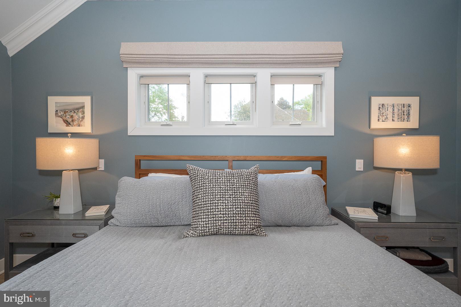 945 Lafayette Road Bryn Mawr, PA 19010 - Photo 23 of 53 a bedroom with a bed and a lamp