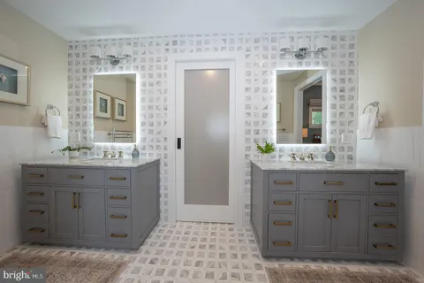 a utility room with sink dryer and washer