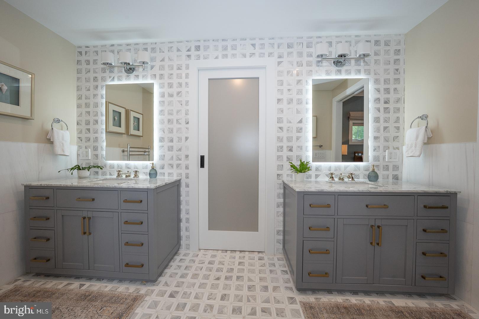 945 Lafayette Road Bryn Mawr, PA 19010 - Photo 28 of 53 a bathroom with a granite countertop sink a mirror and a