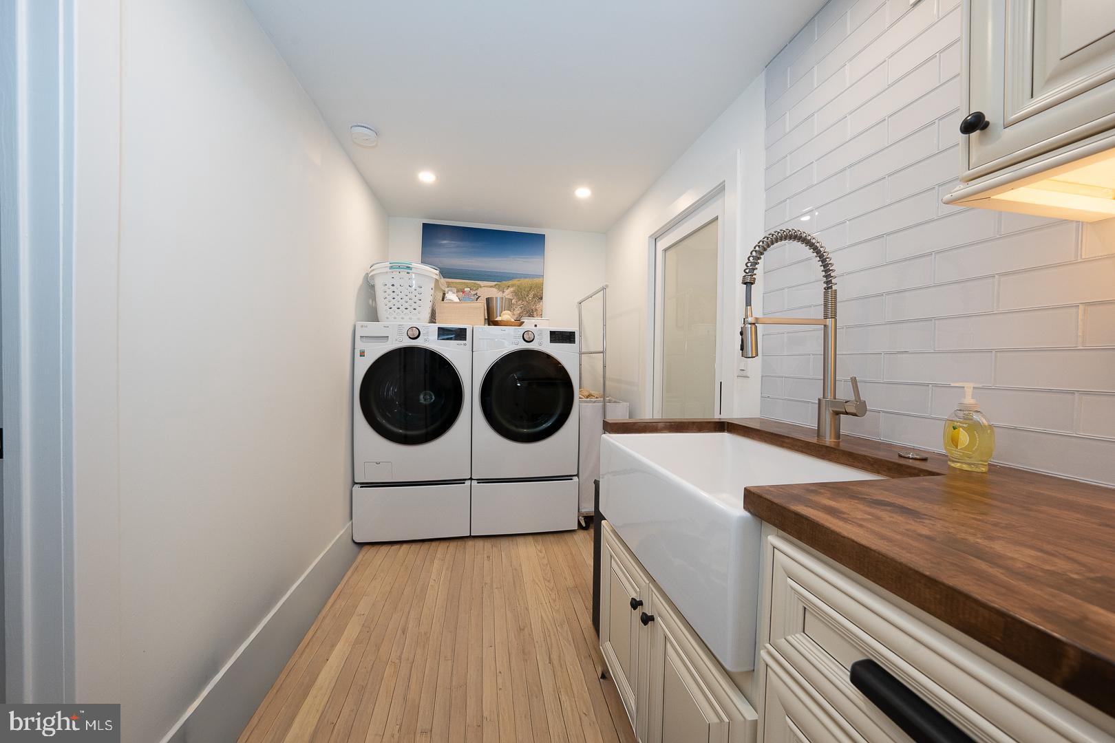 945 Lafayette Road Bryn Mawr, PA 19010 - Photo 29 of 53 a utility room with sink dryer and washer