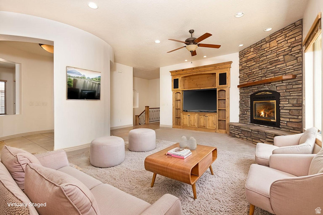 888 East Fiddlers Canyon Road Cedar City, UT 84721 - Photo 11 of 74 Living room with ceiling fan, a fireplace, recessed lighting, and light colored carpet