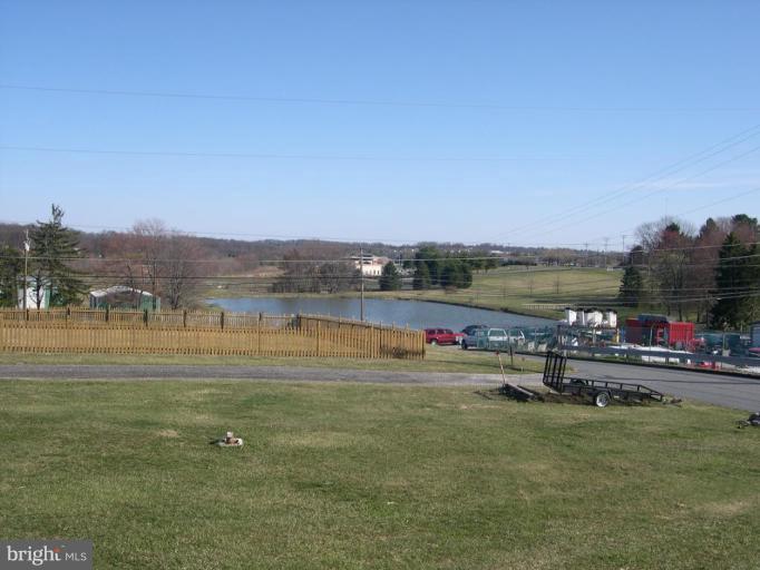 3538 Basler Road Hampstead, MD 21074 - Photo 14 of 14 a view of a lake with houses in the back