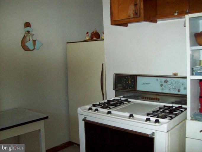 3538 Basler Road Hampstead, MD 21074 - Photo 7 of 14 a stove top oven sitting inside of a kitchen
