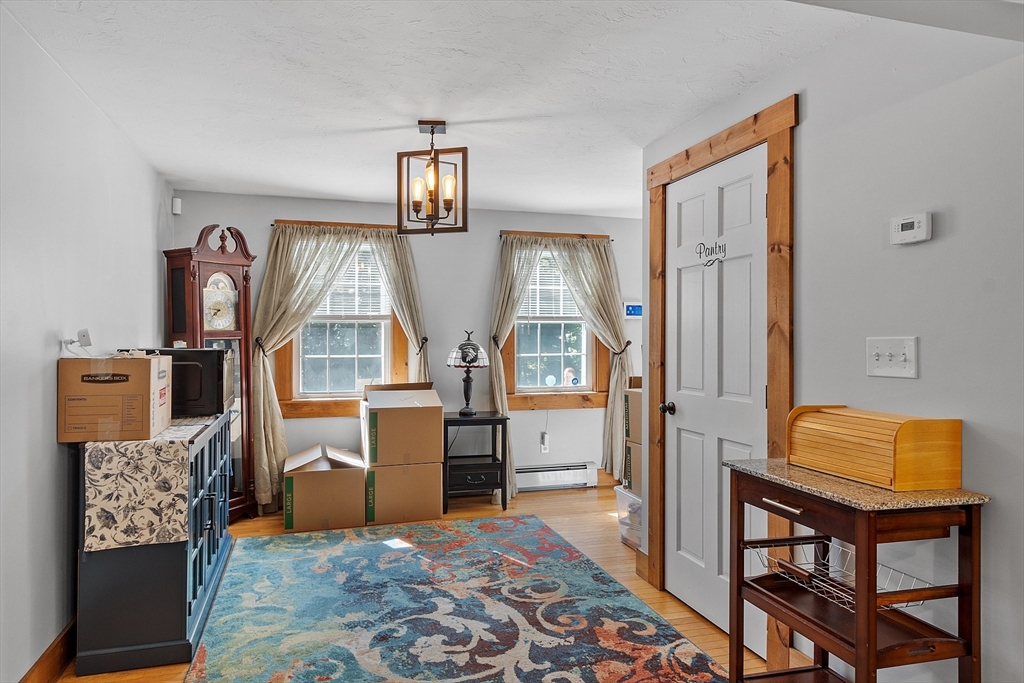 76 Ferin Road Ashburnham, MA 01430 - Photo 11 of 41 a living room with furniture and painting on the wall