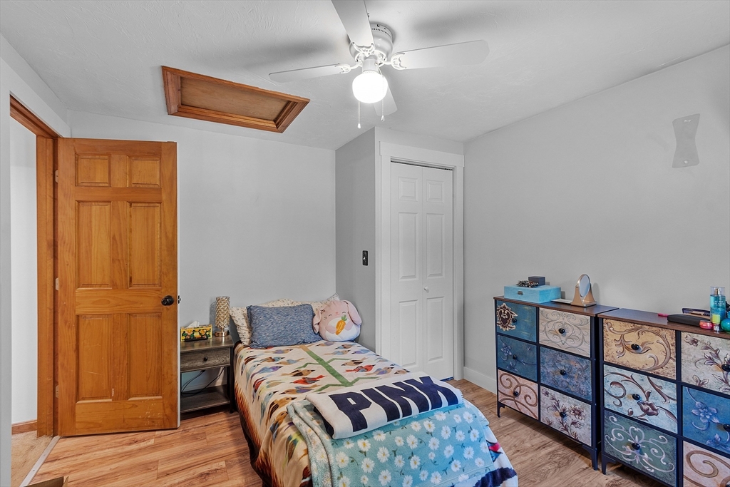 76 Ferin Road Ashburnham, MA 01430 - Photo 18 of 41 a bedroom with a bed and wooden floor