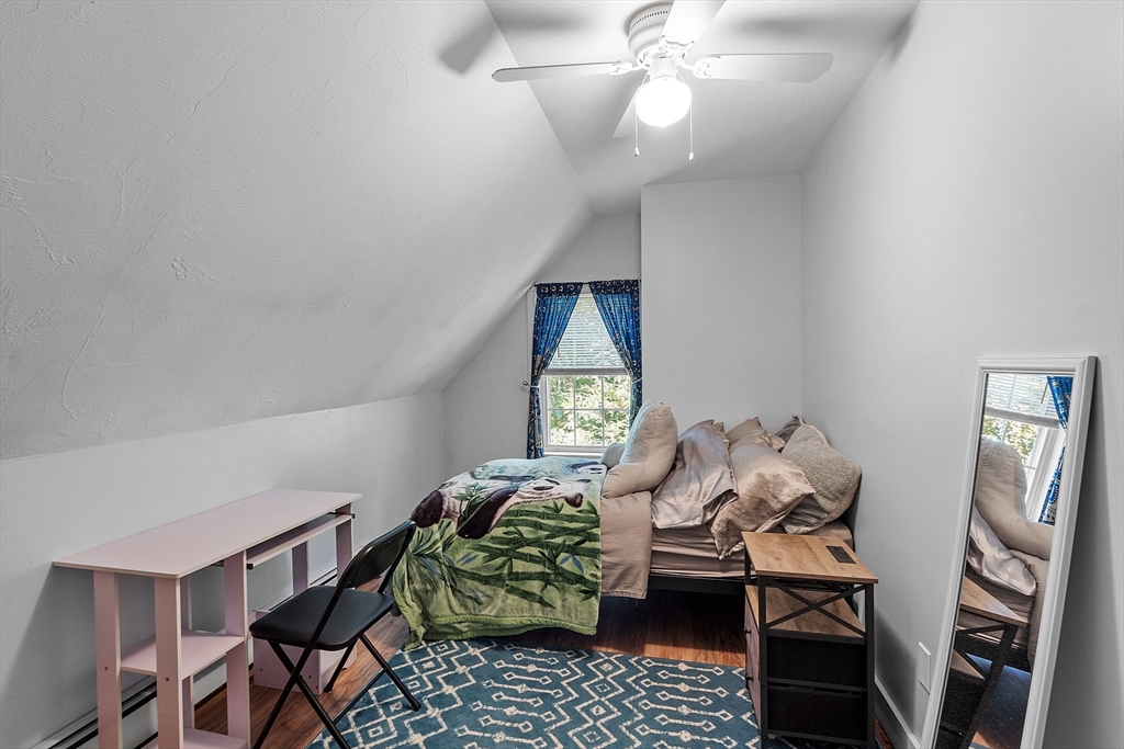76 Ferin Road Ashburnham, MA 01430 - Photo 19 of 41 a bedroom with furniture and a chandelier