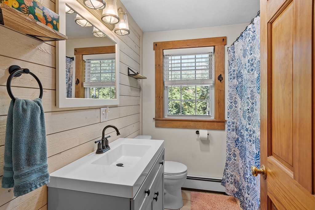 76 Ferin Road Ashburnham, MA 01430 - Photo 20 of 41 a bathroom with a sink a toilet and a window