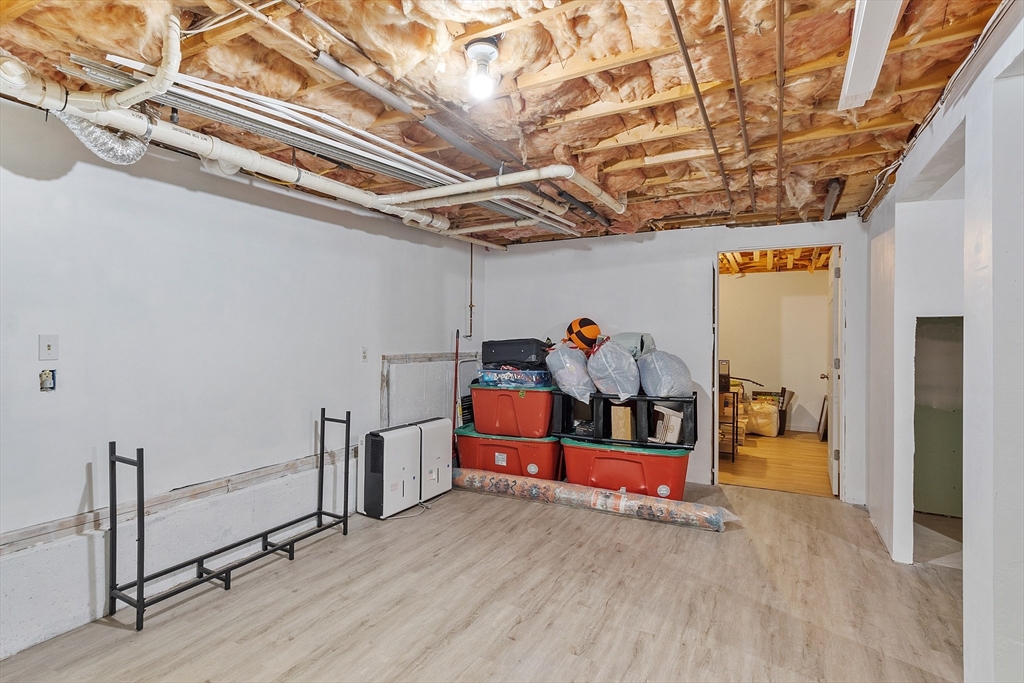 76 Ferin Road Ashburnham, MA 01430 - Photo 22 of 41 a view of a room with wooden shelves