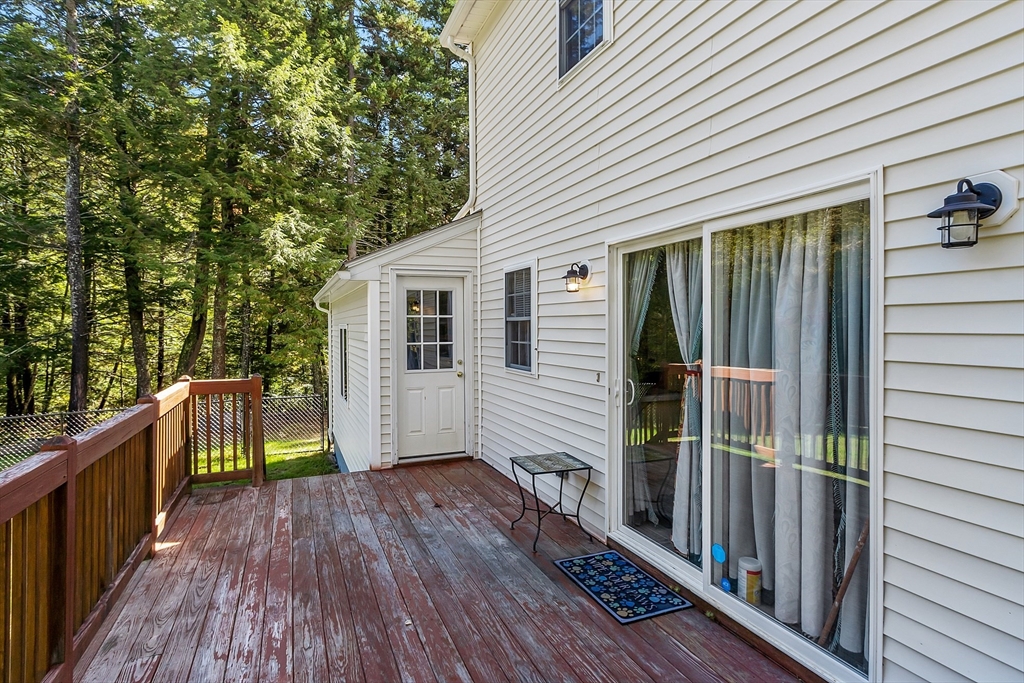 76 Ferin Road Ashburnham, MA 01430 - Photo 27 of 41 a view of balcony with wooden floor and fence