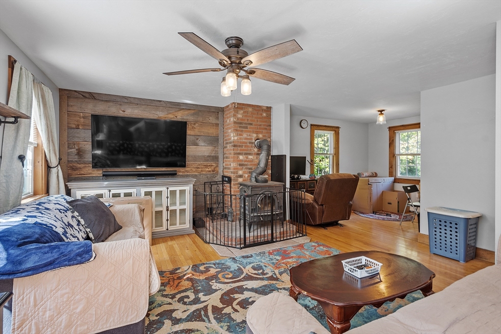 76 Ferin Road Ashburnham, MA 01430 - Photo 5 of 41 a living room with furniture and a flat screen tv