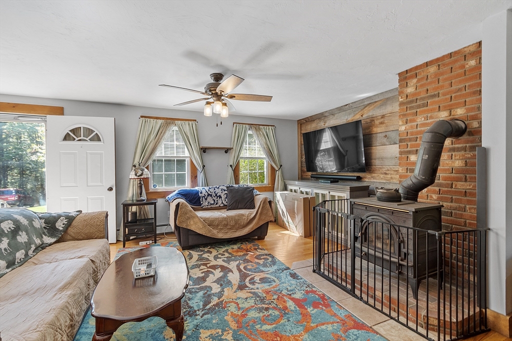 76 Ferin Road Ashburnham, MA 01430 - Photo 6 of 41 a living room with furniture and a flat screen tv