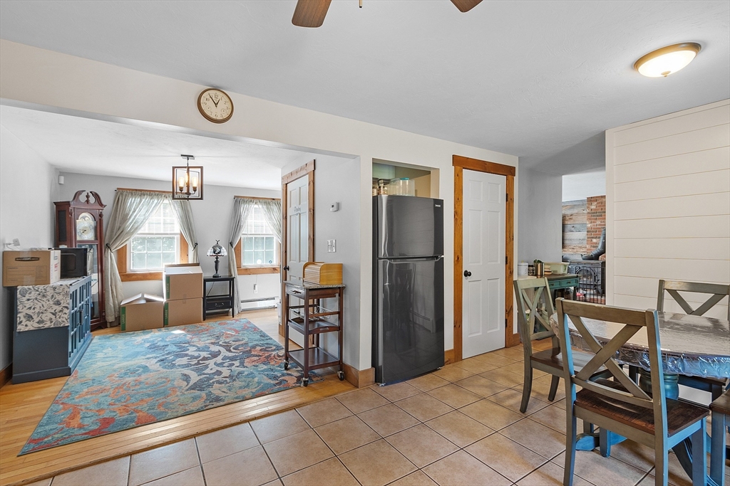 76 Ferin Road Ashburnham, MA 01430 - Photo 10 of 41 a kitchen with stainless steel appliances kitchen island granite countertop dining table chairs and granite counter top