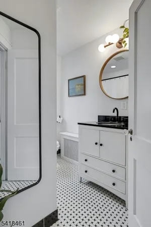 a view of a house with a big yard plants and large trees