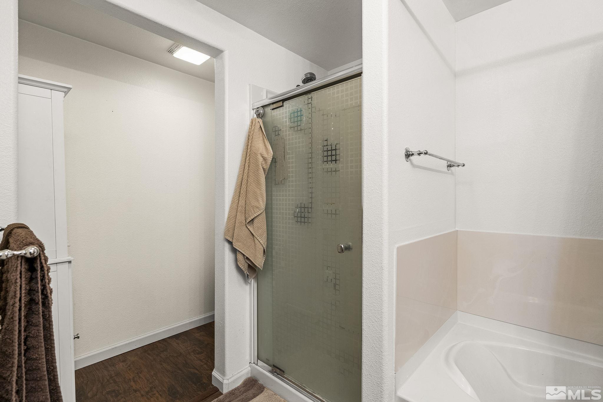 9050 Double R Boulevard, Unit 1211 Reno, NV 89521 - Photo 16 of 20 a bathroom with a shower and a tub