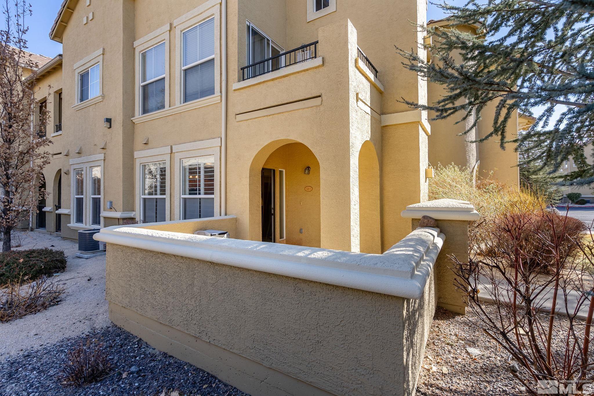 9050 Double R Boulevard, Unit 1211 Reno, NV 89521 - Photo 2 of 20 a view of a building with a bench