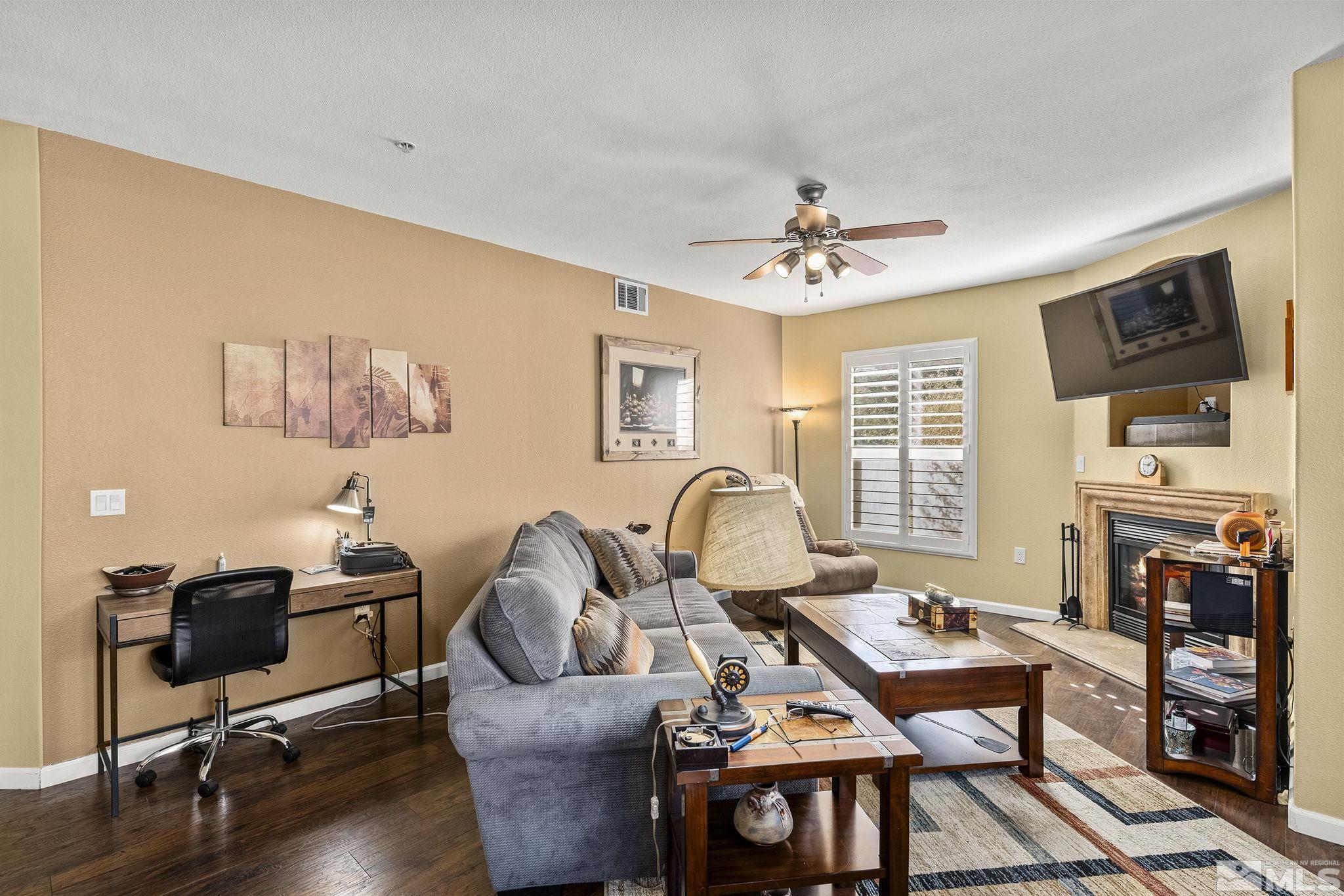 9050 Double R Boulevard, Unit 1211 Reno, NV 89521 - Photo 5 of 20 a workspace with furniture hardwood and a window