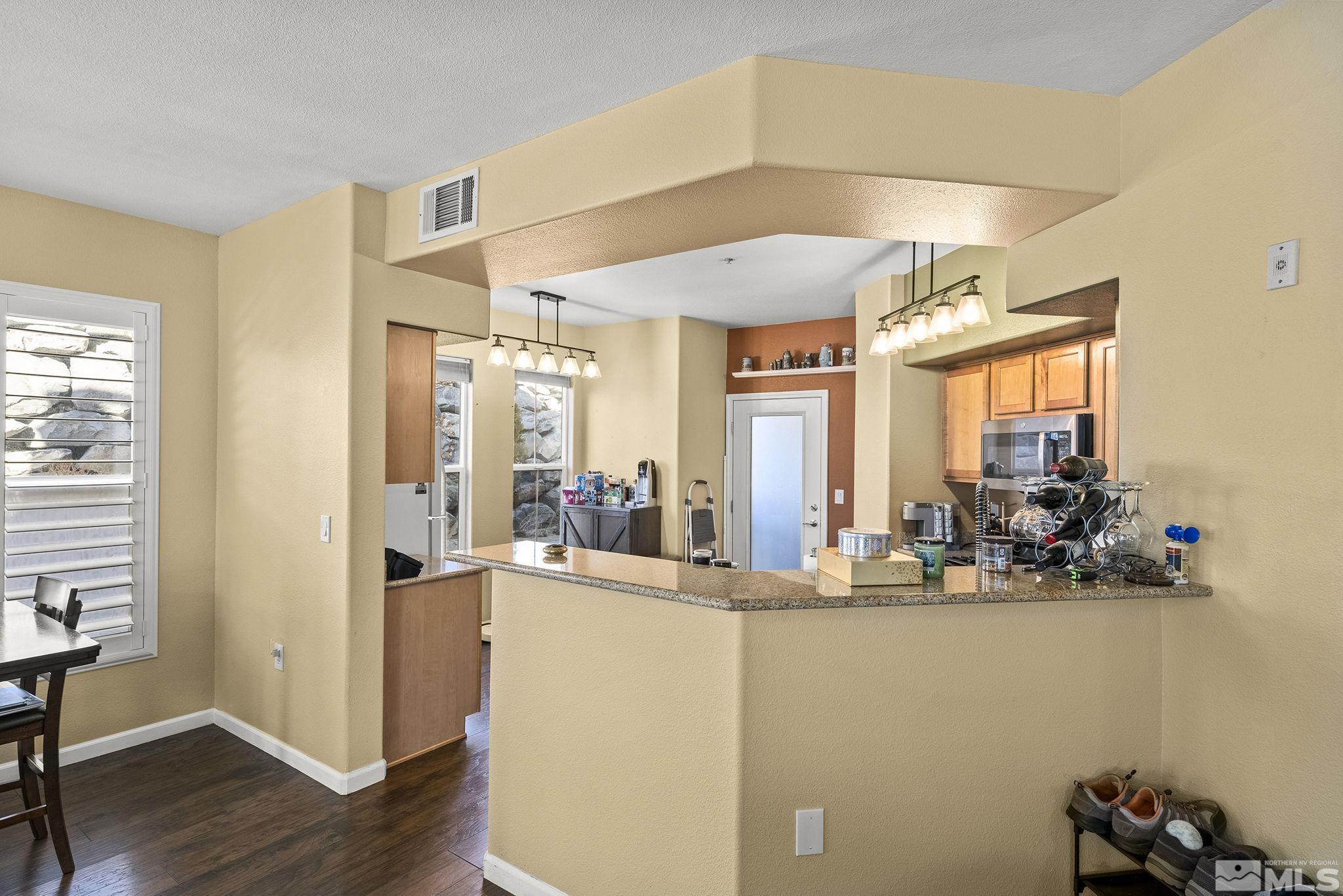 9050 Double R Boulevard, Unit 1211 Reno, NV 89521 - Photo 9 of 20 a view of a living room and dining room