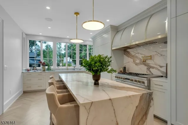 a kitchen with sink and mirror