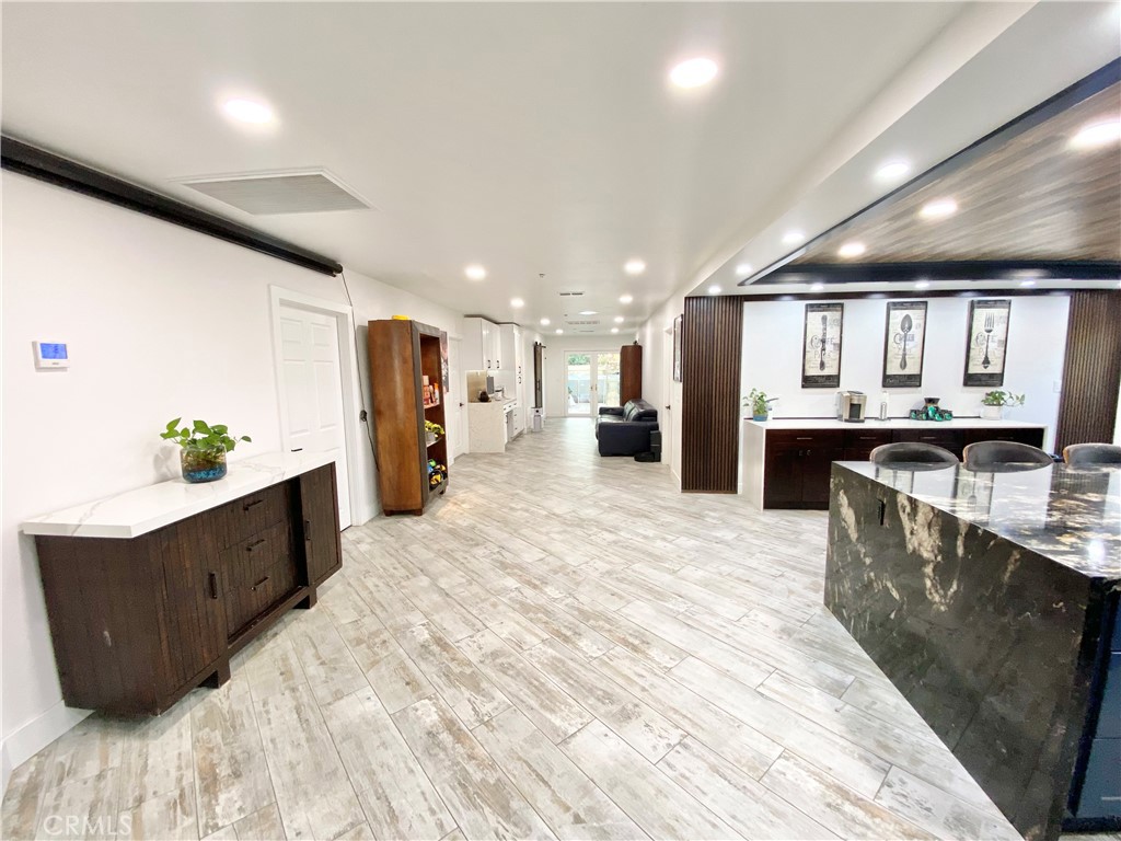 15925 Winchester Way Riverside, CA 92508 - Photo 4 of 25 a large kitchen with stainless steel appliances kitchen island a large counter top and a refrigerator