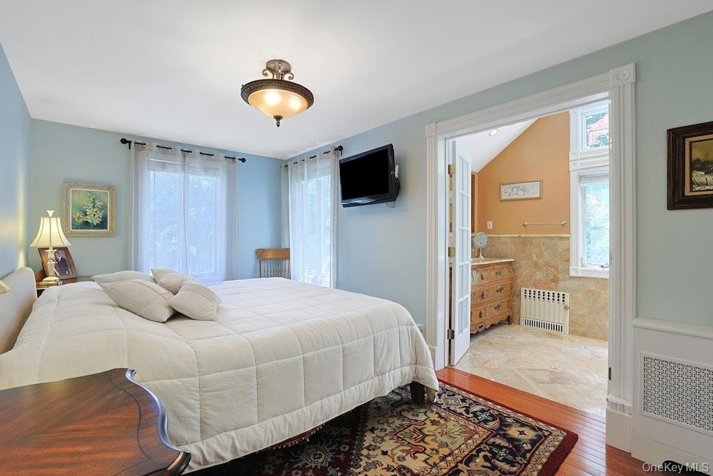 97 Underhill Road Scarsdale, NY 10583 - Photo 17 of 39 a bedroom with a bed and a view of living room
