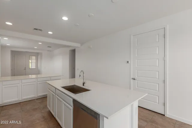 a kitchen with a sink and a window
