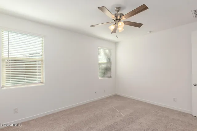 a bathroom with a shower and a glass door