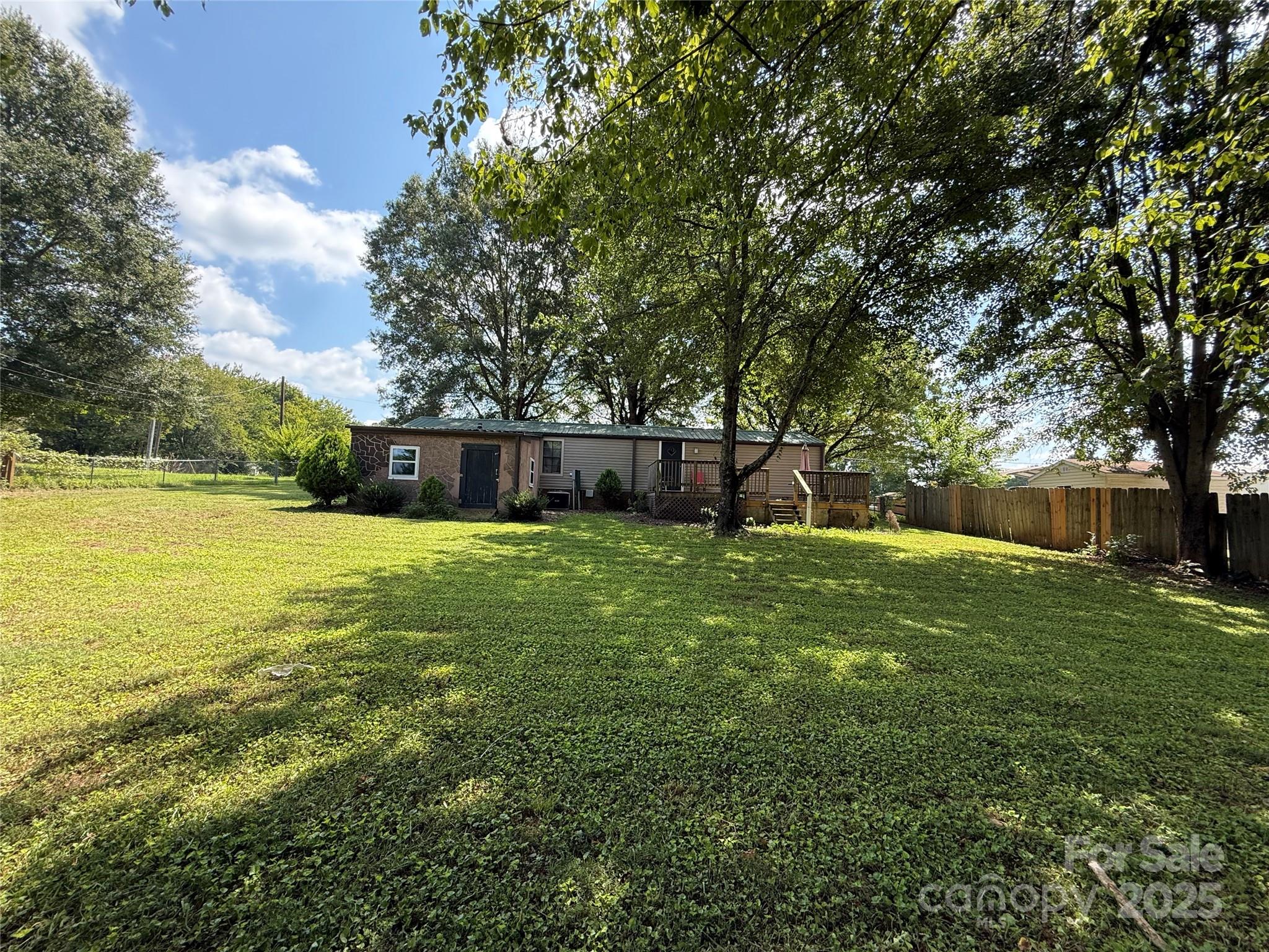 4793 Panama Drive Conover, NC 28613 - Photo 19 of 21 a view of a backyard with a large tree