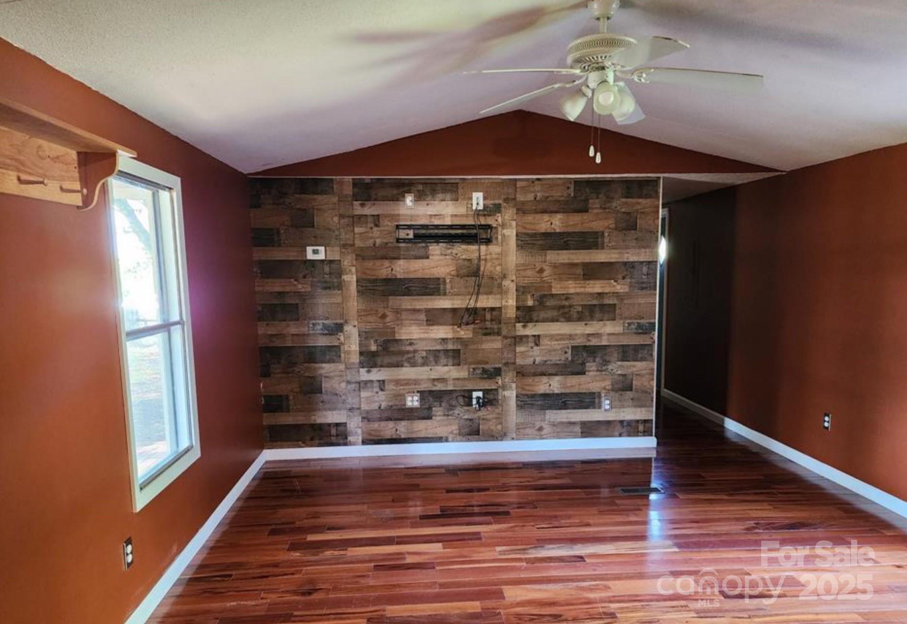 4793 Panama Drive Conover, NC 28613 - Photo 6 of 21 a view of a big room with wooden floor staircase and a living room