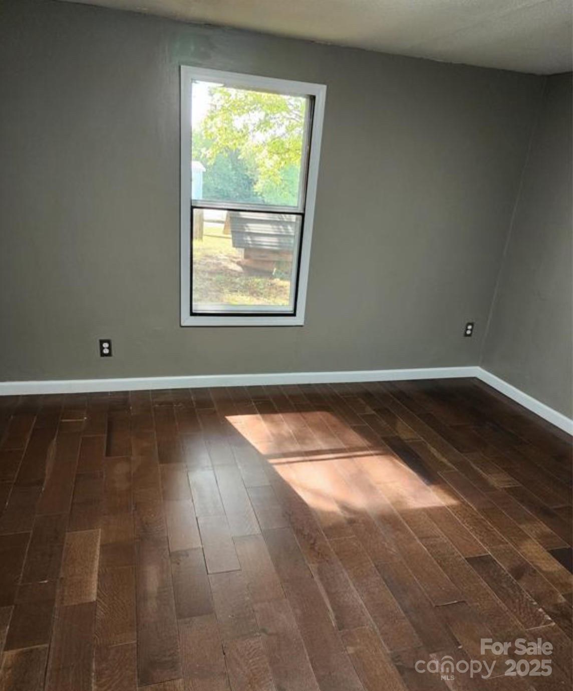 4793 Panama Drive Conover, NC 28613 - Photo 8 of 21 an empty room with wooden floor and windows