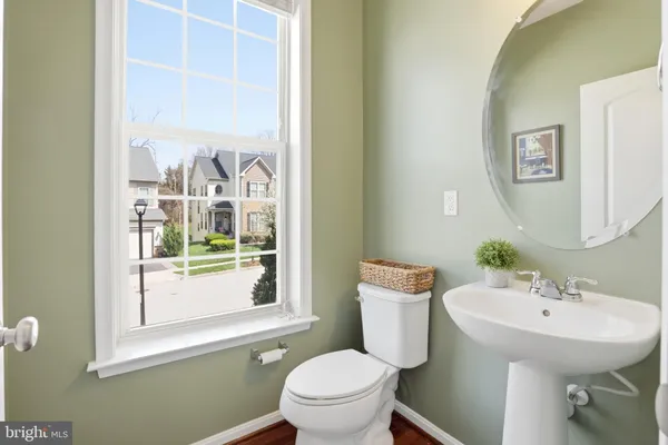 a spacious bedroom with a bed and a chandelier