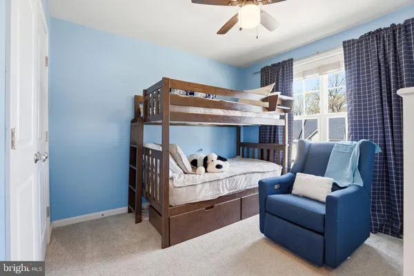 a bedroom with a bed and cabinets