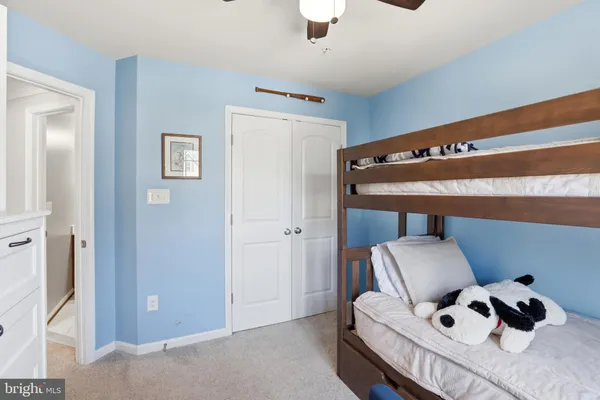 a bedroom with furniture and a window