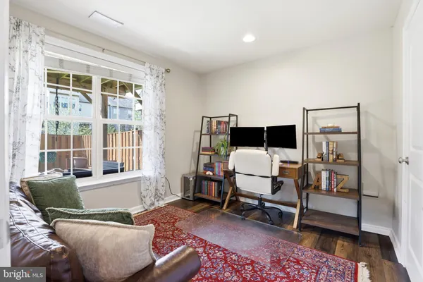 a living room with furniture and a rug