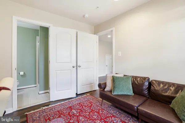 a bathroom with a sink a toilet and mirror