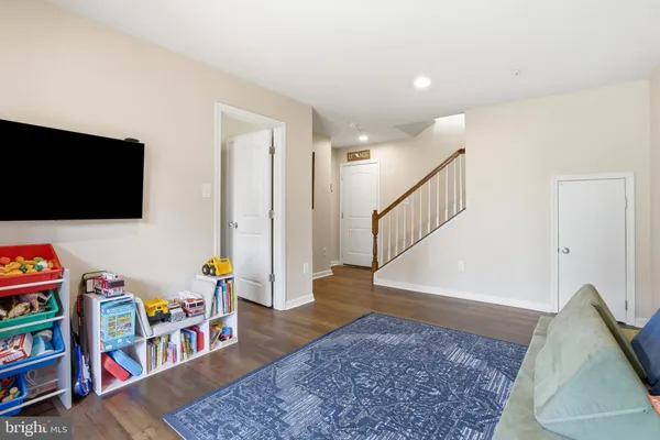 a living room with furniture and a rug